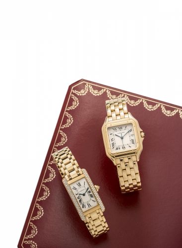 Cartier. A lady's 18K gold and diamond set quartz bracelet watch with box and papers