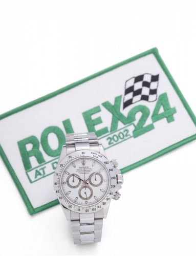 Rolex. A rare and unusual stainless steel automatic chronograph bracelet watch presented to the Daytona 24 hour winner Michael Lauer with box and patch