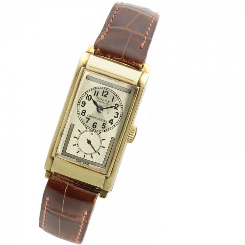 Rolex. A 9K gold manual wind rectangular wristwatch