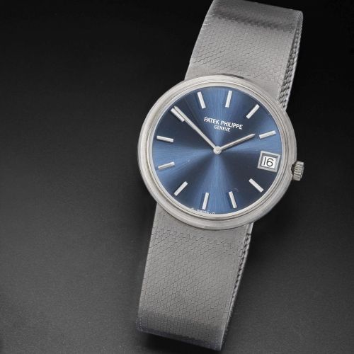 Patek Philippe. An 18k white gold automatic calendar bracelet watch