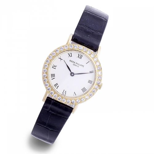 Patek Philippe. A lady's 18k gold and diamond set quartz wristwatch