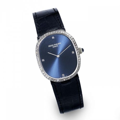 Patek Philippe. A mid size 18K white gold and diamond set manual wind wristwatch