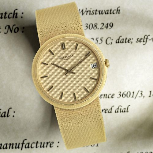 Patek Philippe. An 18K gold automatic calendar bracelet watch