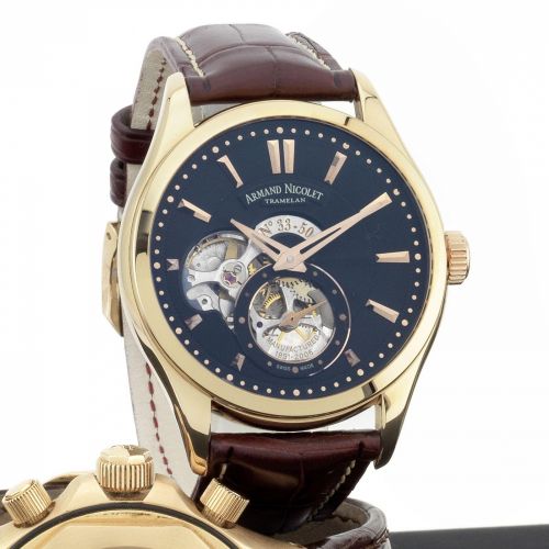 Armand Nicolet. An 18K rose gold manual wind wristwatch