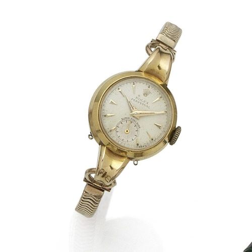 Rolex. A lady's 18K gold automatic bracelet watch