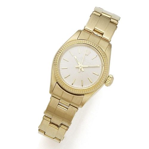 Rolex. A lady's 18K gold automatic bracelet watch