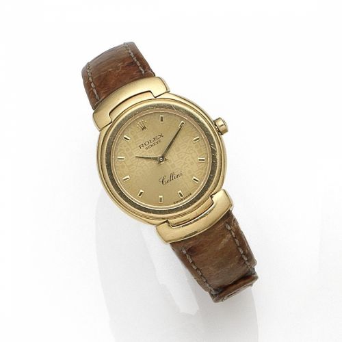 Rolex. A lady's 18K gold quartz wristwatch