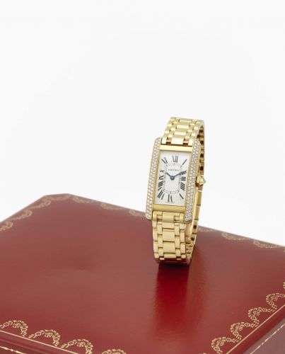 Cartier. A lady's 18K gold and diamond set quartz bracelet watch with box and papers