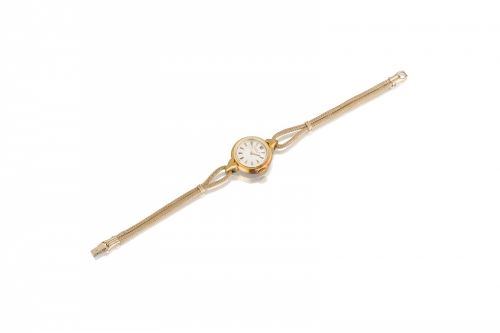 Patek Philippe. A fine 18K gold lady's wristwatch and a 14k gold strap