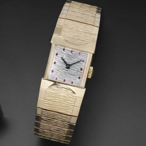 Patek Philippe. An unusual 18K rose gold and ruby set rectangular manual wind bracelet watch