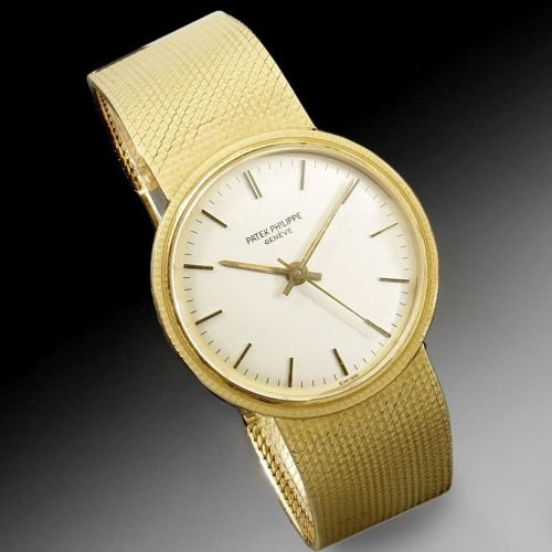 Patek Philippe. An 18K gold automatic bracelet watch