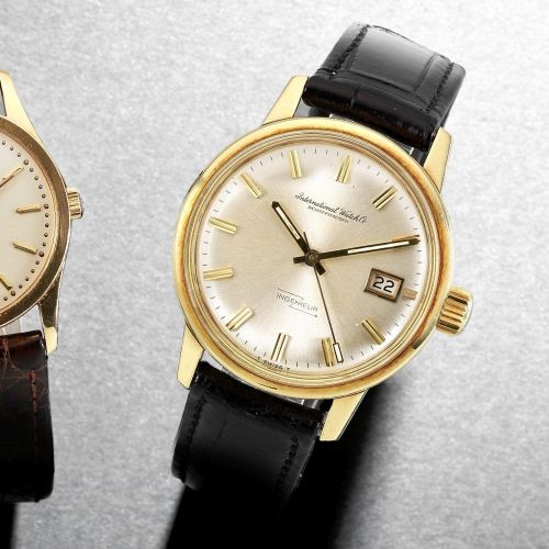 IWC. An 18k gold automatic calendar wristwatch
