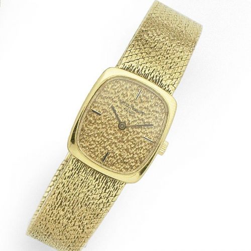 Patek Philippe. A lady's 18K gold manual wind bracelet watch