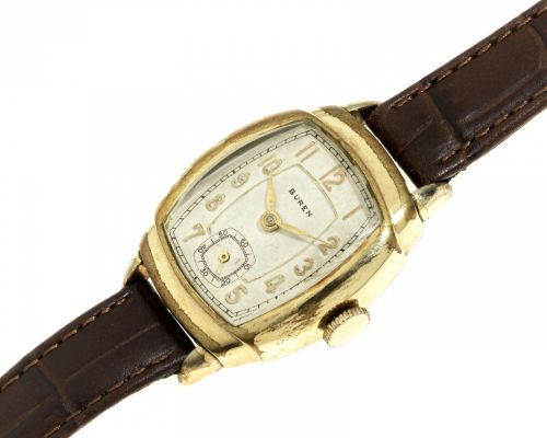 Buren. A gold plated and stainless steel manual wind tonneau wristwatch