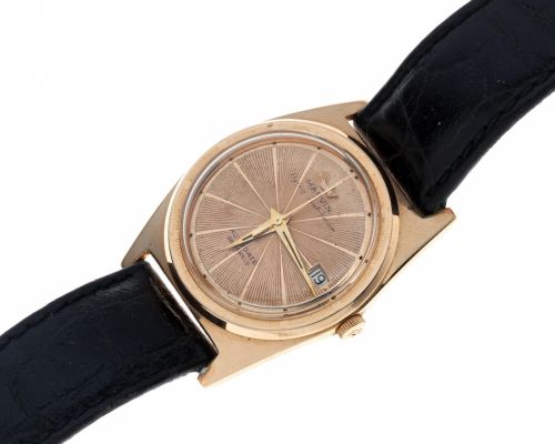 Marvin. An 18K rose gold automatic calendar tonneau wristwatch