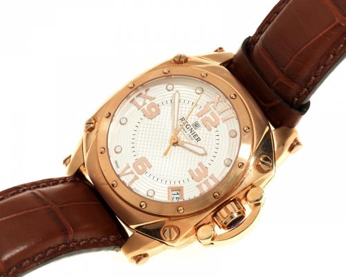 Regnier. A rose gold plated manual wind calendar wristwatch