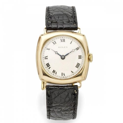 Rolex. A 9K gold manual wind cushion form wristwatch