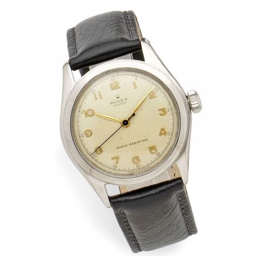 Rolex. A stainless steel manual wind wristwatch