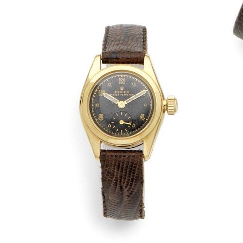 Rolex. A Lady's 18K gold automatic wristwatch