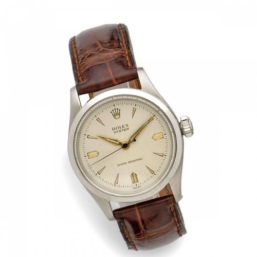 Rolex. A mid-sized stainless steel manual wind wristwatch