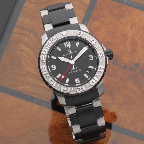 Blancpain. A steel and rubber automatic calendar bracelet watch with dual time zone