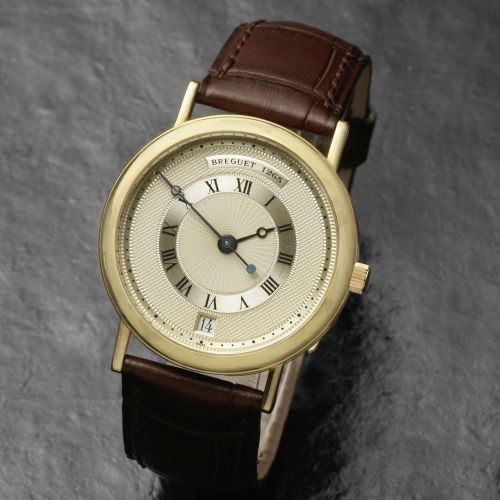 Breguet. An 18K gold manual wind calendar wristwatch