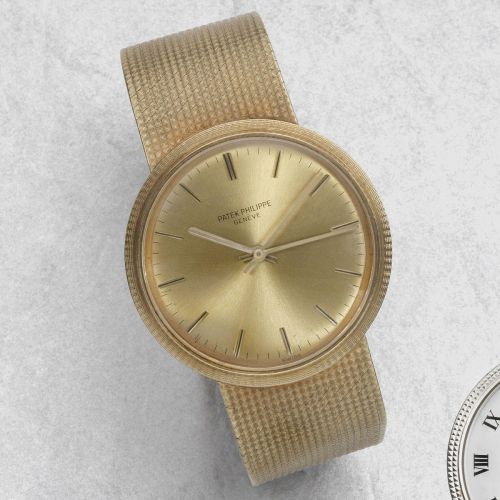 Patek Philippe. An 18K gold automatic back winding bracelet watch with centre seconds