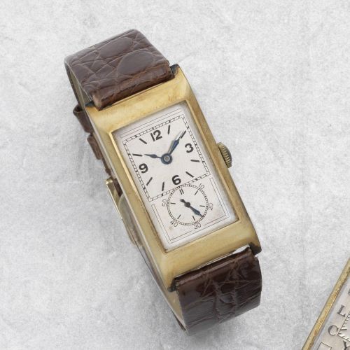Rolex. A 9K gold manual wind rectangular wristwatch