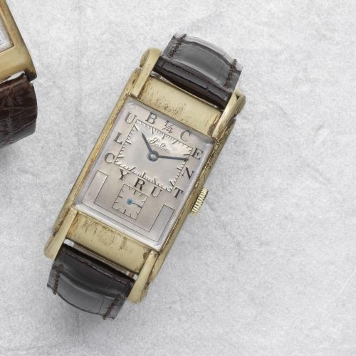 Rolex. An 18K gold manual wind rectangular wristwatch