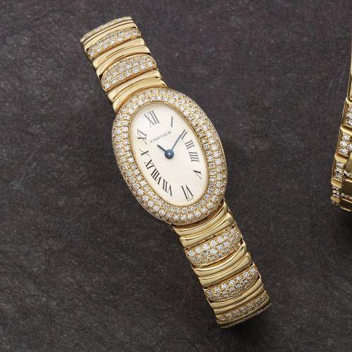 Cartier. A lady's 18K gold and diamond set quartz oval bracelet watch