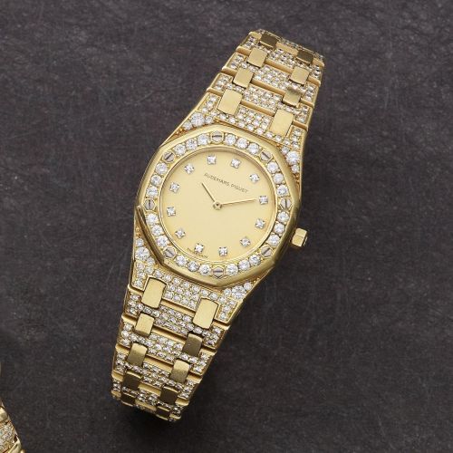 Audemars Piguet. A lady's 18K gold and diamond set quartz bracelet watch