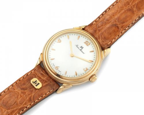 Jean Marcel. An 18K rose gold manual wind wristwatch