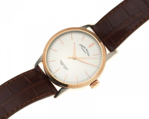 Armand Nicolet. A stainless steel and gold plated manual wind wristwatch