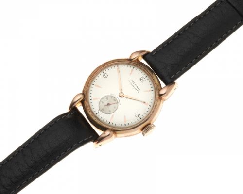 Moeris. A rose gold plated and stainless steel manual wind wristwatch