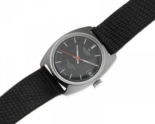 Buren. A stainless steel manual wind tonneau form calendar wristwatch