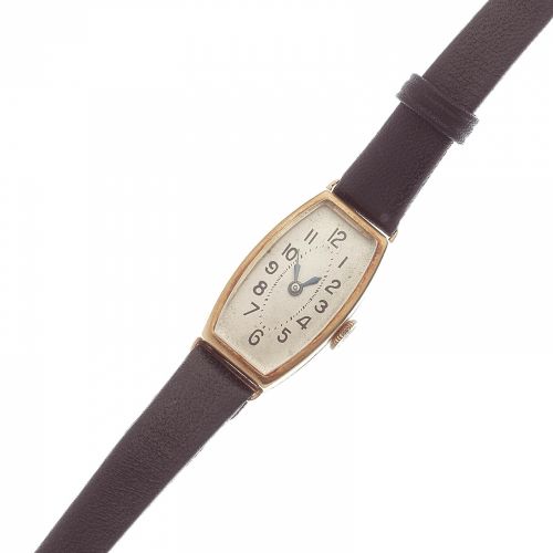 Tavannes. A lady's 18K gold manual wind wristwatch