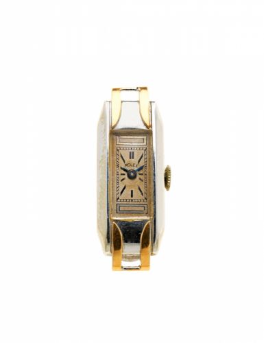 Rolex. A lady's 18K white gold manual wind watch