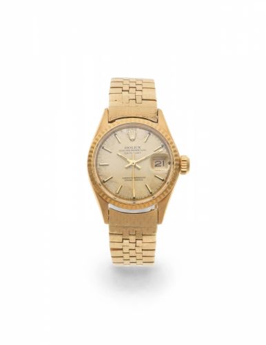Rolex. A lady's 18K gold automatic calendar bracelet watch