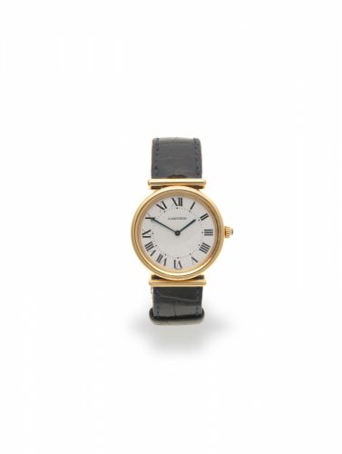 Cartier. An 18K gold manual wind wristwatch