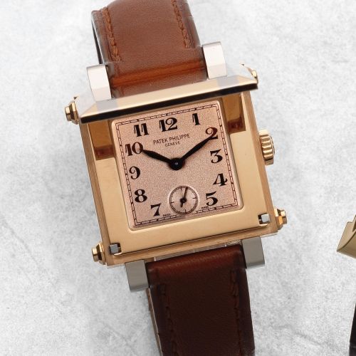 Patek Philippe. An 18K two colour gold manual wind square wristwatch with concealed dial