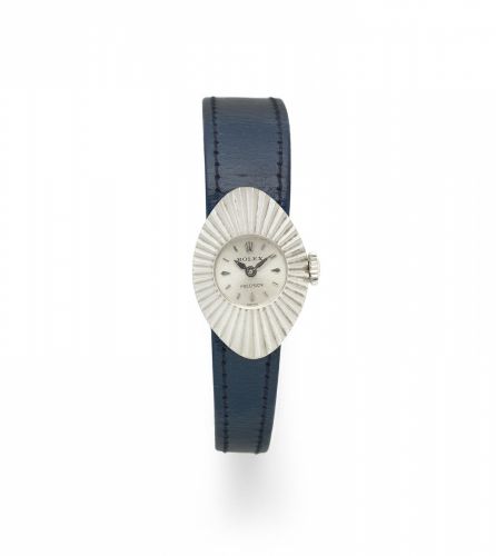 Rolex. A lady's 18K white gold manual wind oval wristwatch with adjustable straps