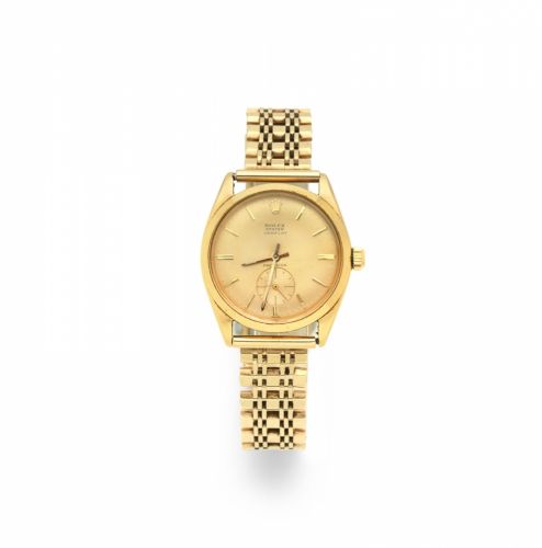 Rolex. An 18K gold manual wind bracelet watch