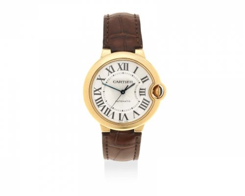 Cartier. An 18K gold automatic wristwatch