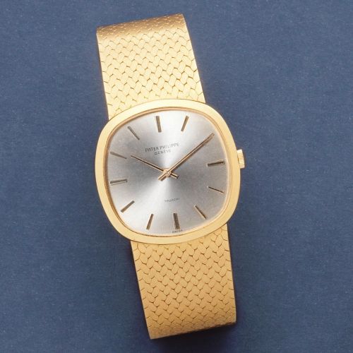 Patek Philippe. An 18K gold manual wind cushion form bracelet watch retailed by Trucchi