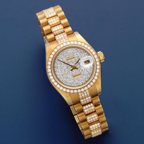Rolex. A lady's 18K gold and diamond set automatic calendar bracelet watch