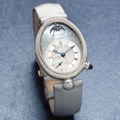 Breguet. A lady's fine 18K white gold and diamond set automatic oval wristwatch with moon phase