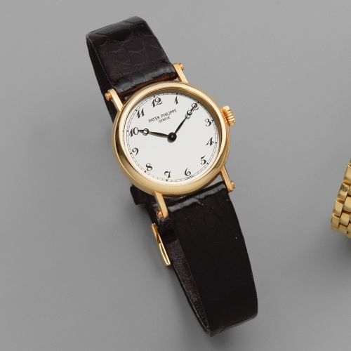 Patek Philippe. A lady's 18K gold manual wind wristwatch
