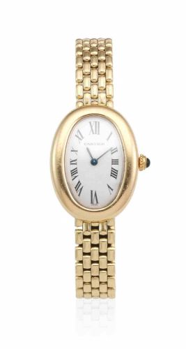Cartier. A lady's 18K gold quartz oval bracelet watch