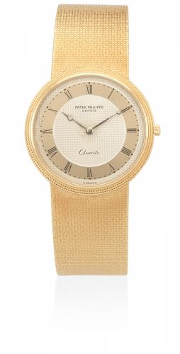 Patek Philippe. An 18K gold quartz bracelet watch