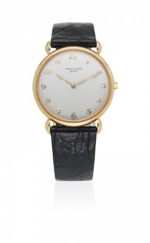 Patek Philippe. An 18K gold manual wind wristwatch